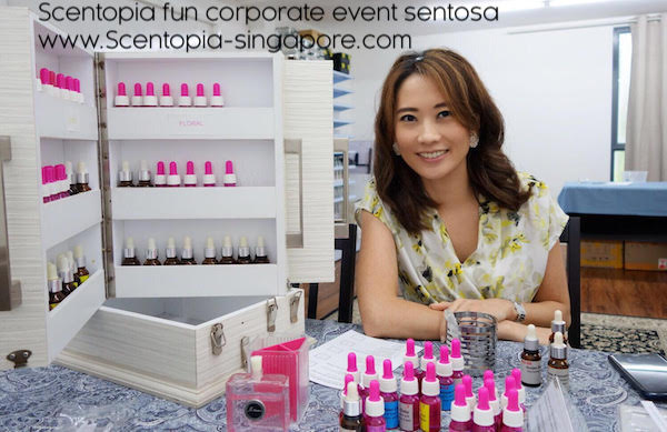 Essential oil cabinet at scentopia with lady perfumer