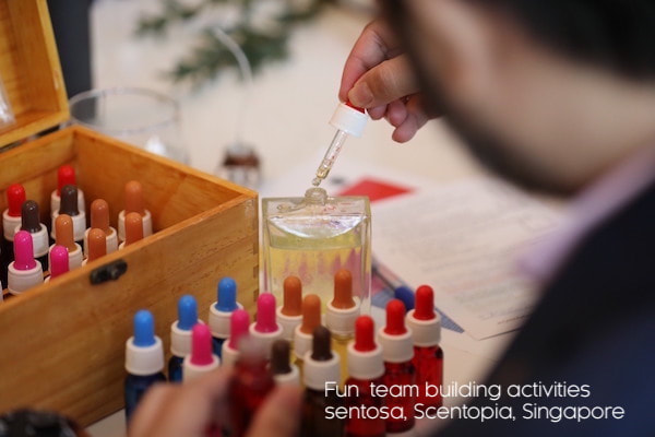 man making perfume at team building event