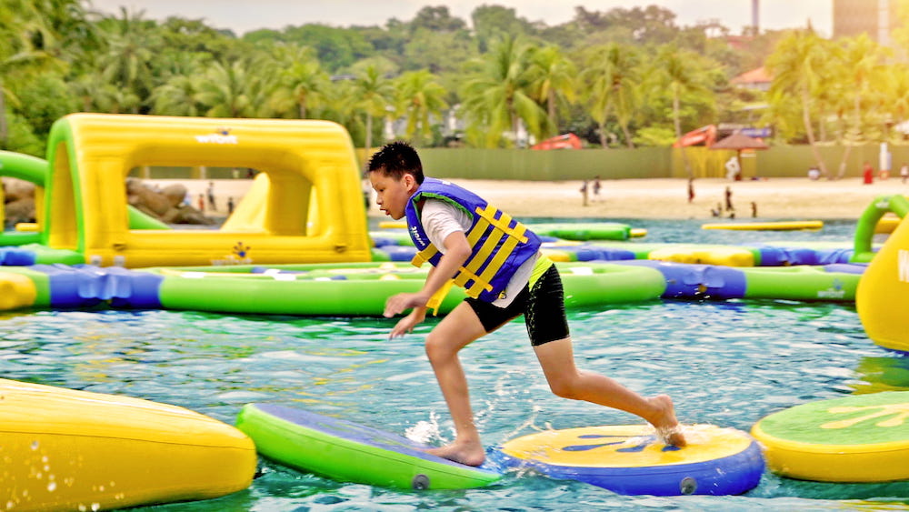 boy enjoying at HydroDash - Floating Aqua Park sentosa singapore