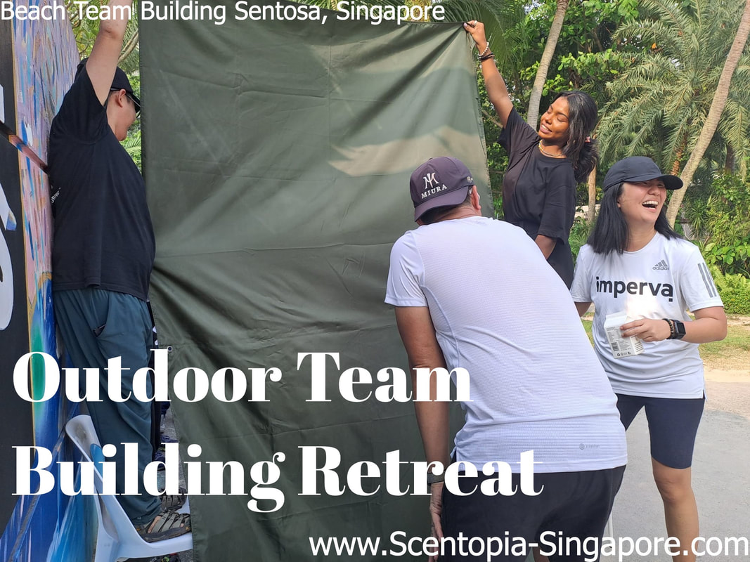 group laughing at Outdoor Team Building Retreat