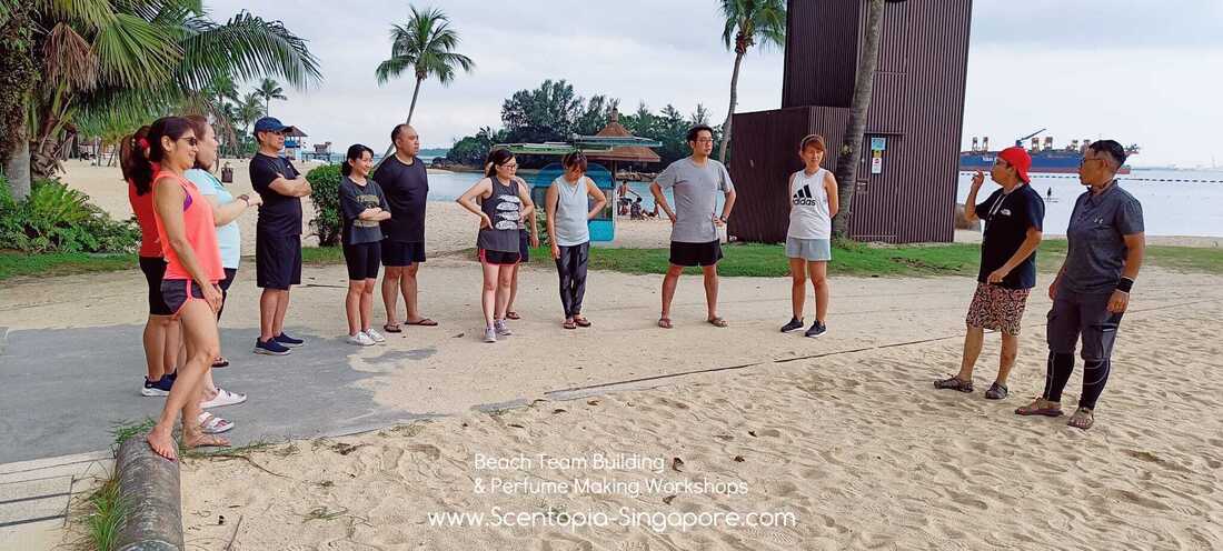 corporate group at beach team building day at siloso sentosa