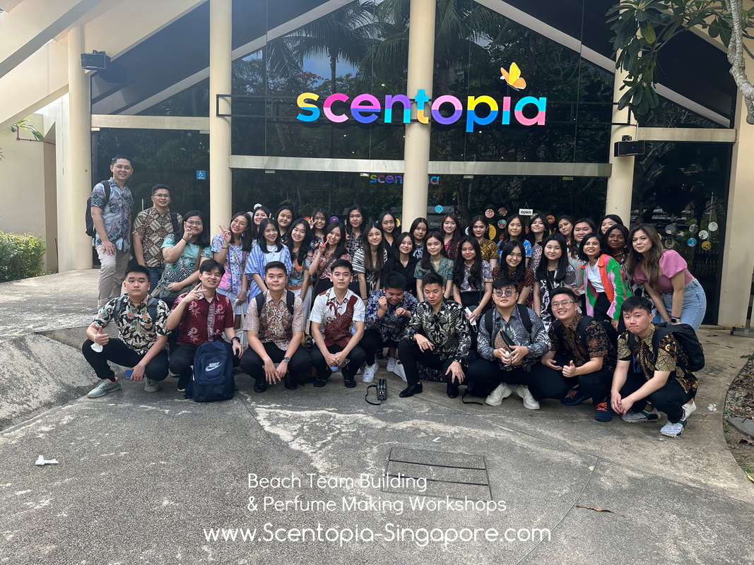 team taking picture at scentopia after event