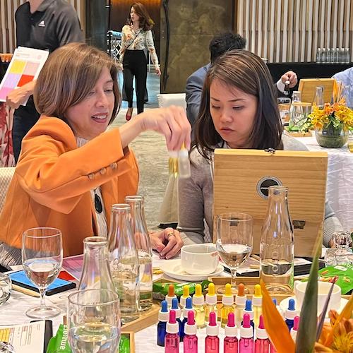 ladies choosing their essential oils for perfume making workshop